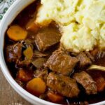 Traditional Irish Beef Stew with chunks of beef, carrots, onions, celery simmered in brown gravy #beef #stew #winterfood #healthy #happilyunprocessed