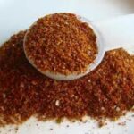 Spoon filled with taco seasoning