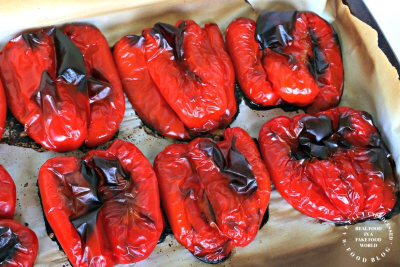 roasted red peppers cut in half on bakig sheet