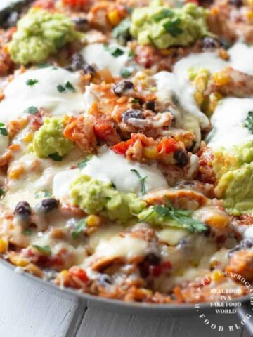 shredded chicken, black beans, corn, tomatoes and rice simmered in enchilada sauce topped with cheese in one skillet
