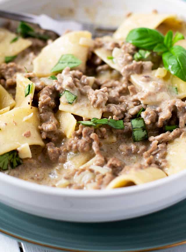 hamburge helper beef stroganoff made from scratch in white bowl with large egg noodles