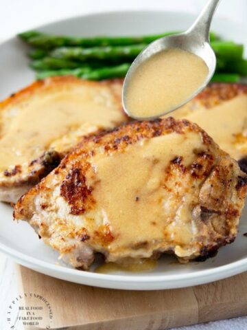 smothered pork chops in a buttermilk gravy #porkchops #pork #healthy #dinner #happilyunprocessed