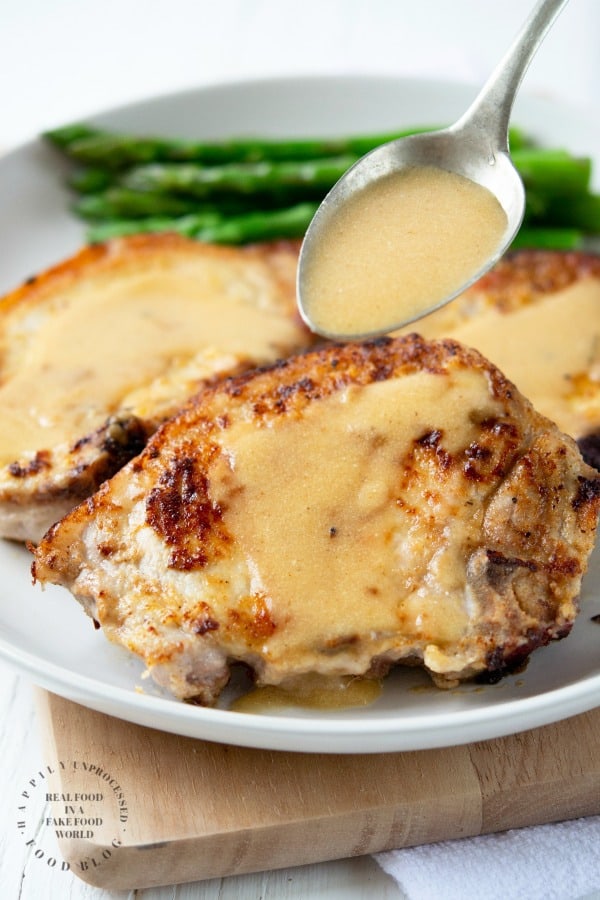 smothered pork chops in a buttermilk gravy #porkchops #pork #healthy #dinner #happilyunprocessed