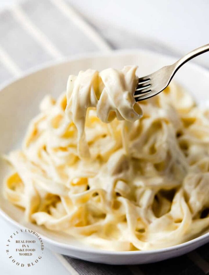 HOMEMADE ALFREDO SAUCE - only 4 ingredients are needed to make this classic Italian rich creamy sauce #alfredo #sauce #happilyunprocessed