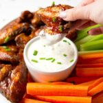 Slow Cooker Chicken wings in a tangy delicious honey buffalo sauce #chickenwings #buffalo #slowcooker #happilyunprocessed