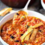 CHICKEN TORTILLA SOUP WITH RICE - perfect blend of Mexican spices, shredded chicken, corn, beans and rice for a filling bowl of soup #soup #chickentortilla #healthy #happilyunprocessed