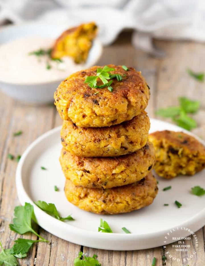 Roasted cauliflower fritters with a Bloomin Onion dipping sauce - roasting the cauliflower takes the water out as well as brings out that caramelized roasted flavor in these fritters #cauliflower #appetizer #vegetarian #happilyunprocessed