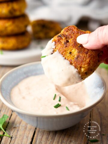 Roasted cauliflower fritters with a Bloomin Onion dipping sauce - roasting the cauliflower takes the water out as well as brings out that caramelized roasted flavor in these fritters #cauliflower #appetizer #vegetarian #happilyunprocessed