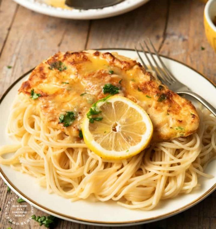 CHICKEN FRANCESE - thinly sliced chicken breasts are floured and egg dipped before sauteeing and simmering in a butter, lemon and wine sauce #chicken #francese #weeknightdinner #happilyunprocessed