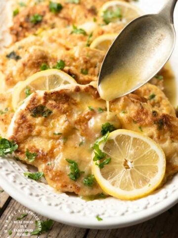 CHICKEN FRANCESE - thinly sliced chicken breasts are floured and egg dipped before sauteeing and simmering in a butter, lemon and wine sauce #chicken #francese #weeknightdinner #happilyunprocessed