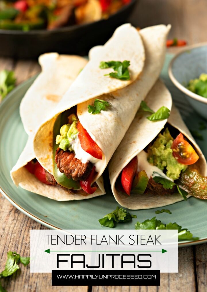 FLANK STEAK FAJITAS - perfectly grilled strips of flank steak with onions and peppers served with fresh tortillas, sour cream, guacamole and salsa #fajitas #happilyunprocessed