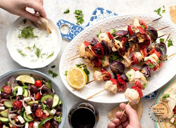 TZATZIKI SAUCE - Greek dinner platter with Greek Chicken Kebobs, layered hummus dip, Greek salad and pita bread #Greek #Tzatziki #hummus #tahini #healthy #happilyunprocessed