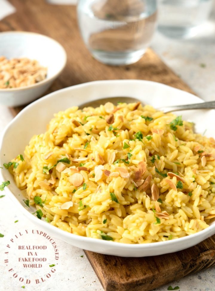 RICE PILAF WITH ORZO AND SLIVERED ALMONDS - No boxed rices! Homemade rice pilaf is the easiest side dish #rice #sidedish #orzo #happilyunprocessed