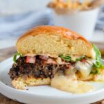 STUFFED BLACK BEAN BURGER with Monterey Jack Cheese - seasoned black beans, diced veggies, spices and cheese make up this delicious meat alternative burger #blackbeanburger #impossiblemeat #vegetarian #dinner #grill #happilyunprocessed