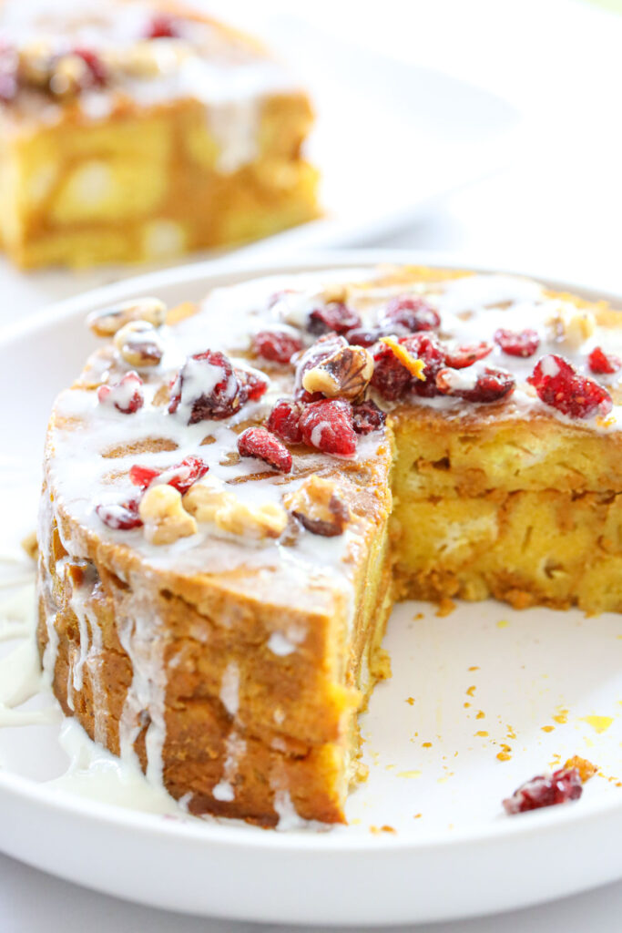 Instant Pot Pumpkin Bread Pudding on a white plate with a slice taken out