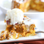 Instant Pot Pumpkin Bread Pudding on a plate with melted vanilla ice cream on top