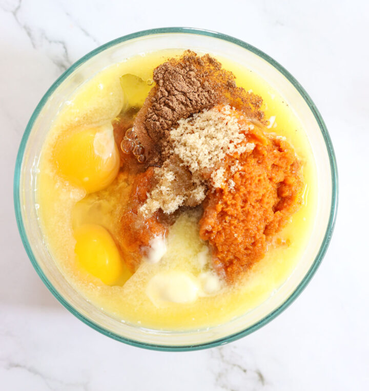 Ingredients in a bowl to make Pumpkin Bread Pudding in an Instant Pot