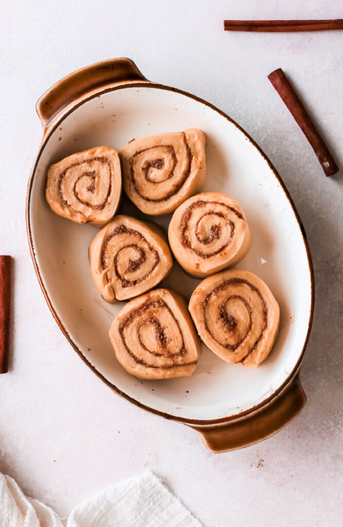 Edit sliced and rolled gingerbread cinnamon rolls in a pan