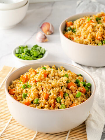 Cauliflower rice in a white bowl is a healthy alternative to chinese rice