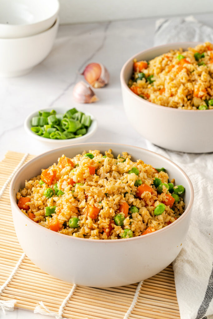 Cauliflower rice in a white bowl is a delicious side dish