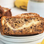 Slice of Banana bread with a cheesecake filling and a cup of coffee
