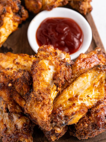 air fryer chicken wings with a side of bbq sauce