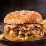 Fried onion smash burger on a sesame seed bun
