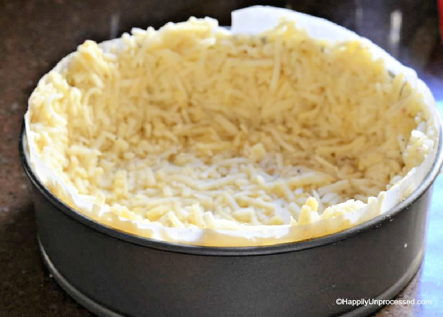 Hashbrowns in a springform pan to make a hashbrown crust for quiche