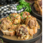french onion meatballs that are baked and bathed in a oniony sauce
