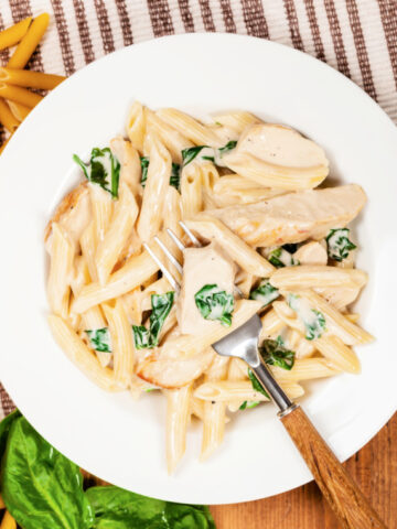 One skillet chicken alfredo with penne pasta and baby spinach