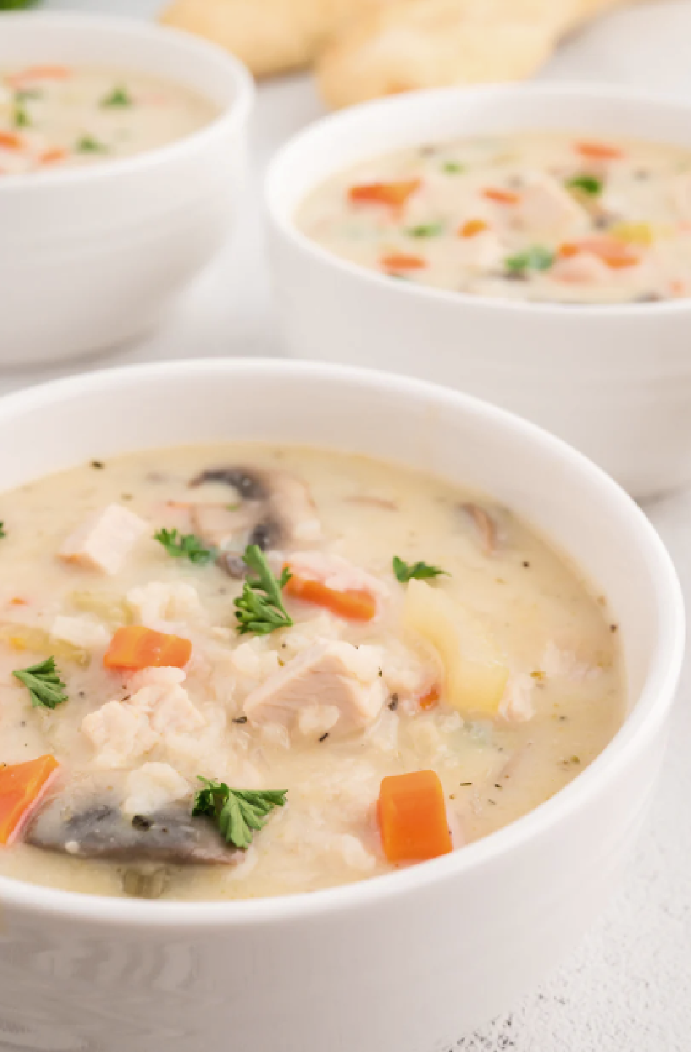 A big bowl of homemade creamy turkey and rice soup using leftover turkey from 
Thanksgiving