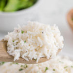 perfectly fluffy coconut rice on a spoon