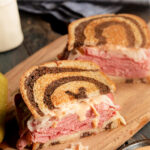 a classic Reuben sandwich with swiss cheese and sauerkraut on rye