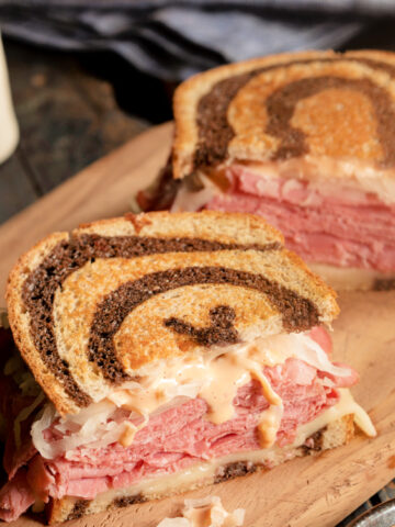 a classic Reuben sandwich with swiss cheese and sauerkraut on rye