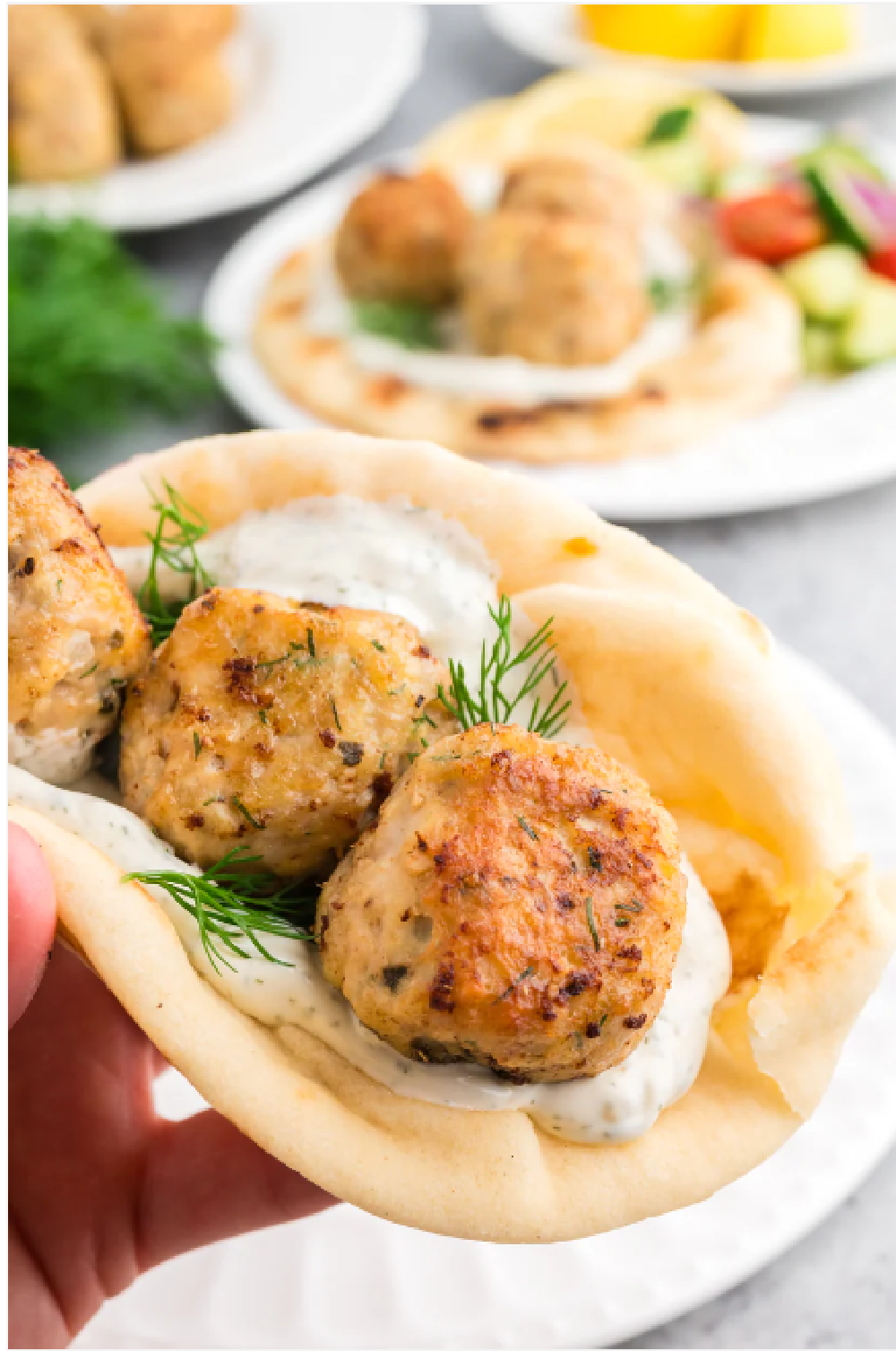 Greek inspired chicken meatballs wrapped in a warm pita