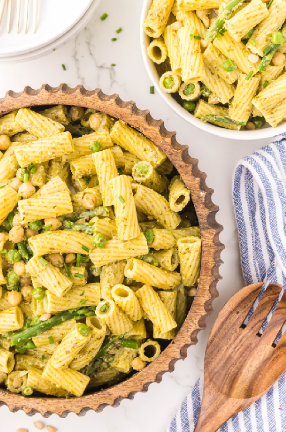 Big rigatoni pasta with fresh peas, asparagus and chickpeas in a green goddess dressing