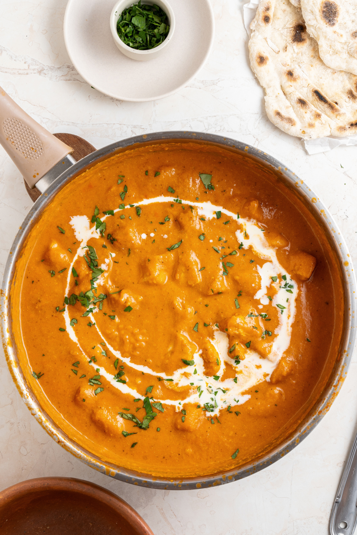 homemade chicken makhani (butter chicken) sauce in a pan with cream
