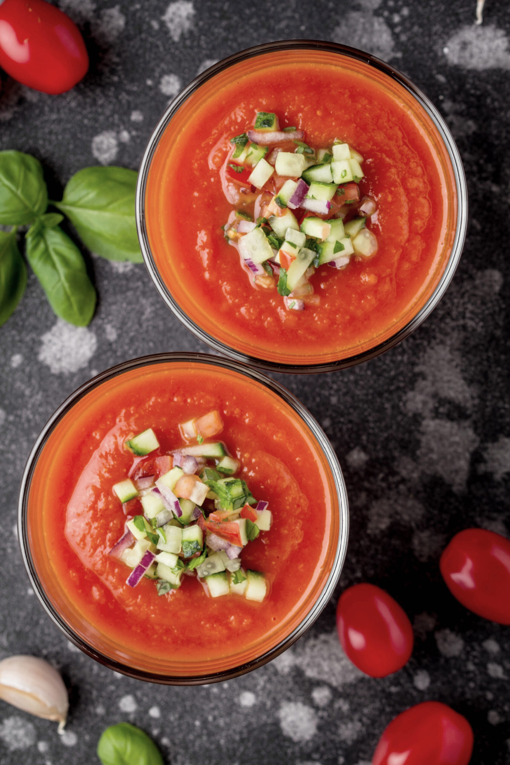 a cool refreshing serving of summer gazpacho with diced cucumber on top