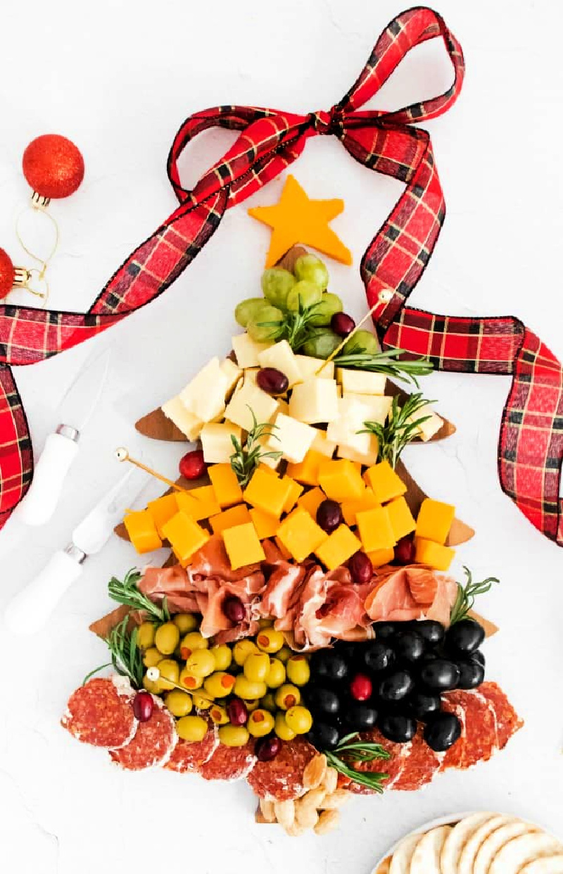 A Christmas tree shaped cheese and olive board for the holidays