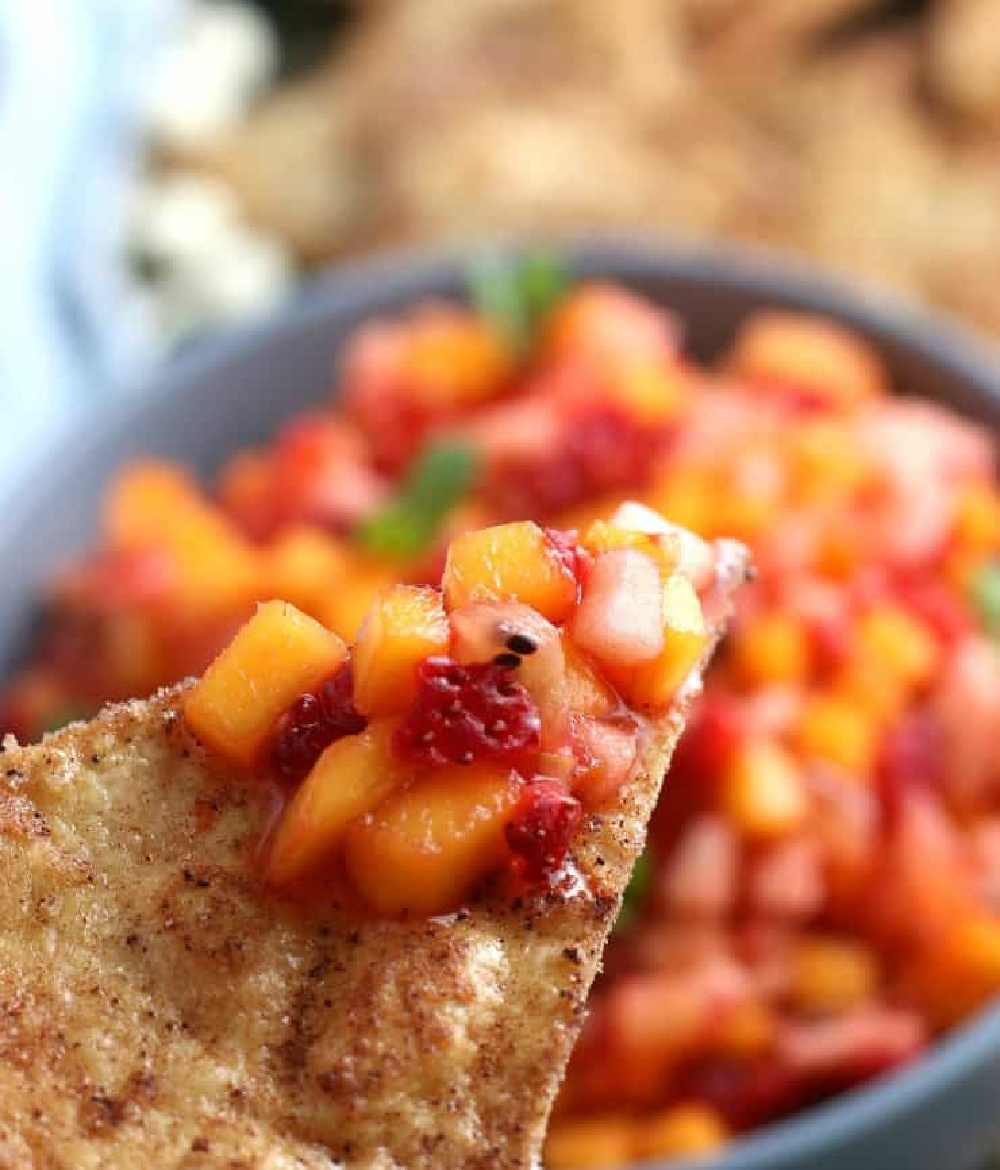 Fruit salsa with fresh diced fruit on homemade cinnamon tortilla chips