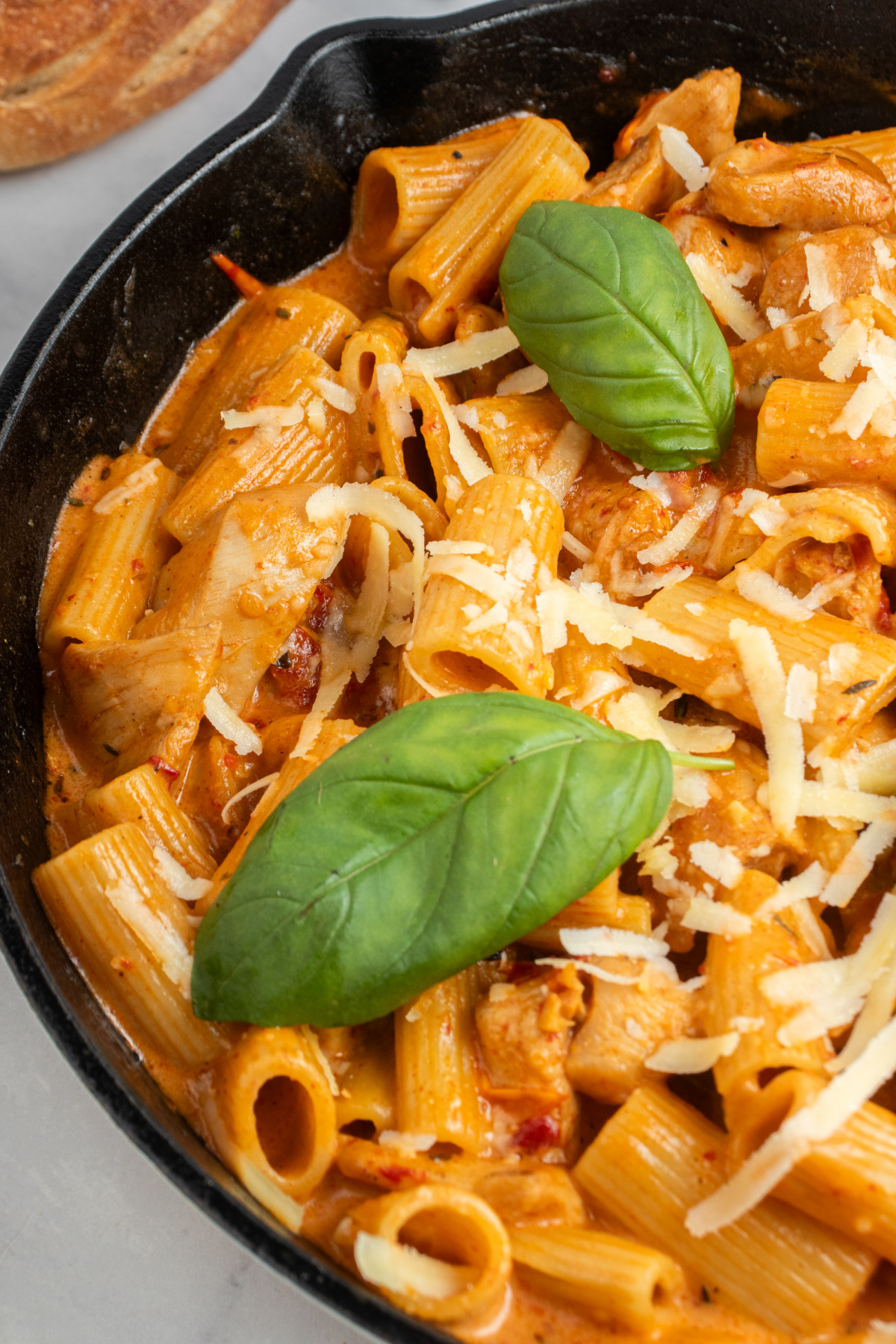 A delicious skillet of pan seared chicken and pasta in a cream sauce called Marry me chicken